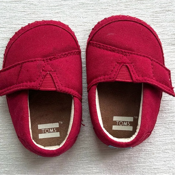 Toms Other - TOM’S tiny red cloth baby shoes w/velcro closure